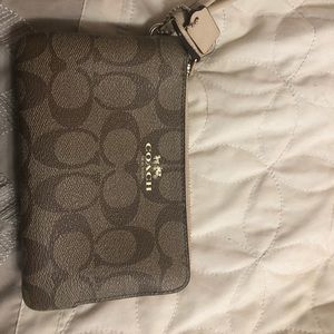 Small Coach wristlet.